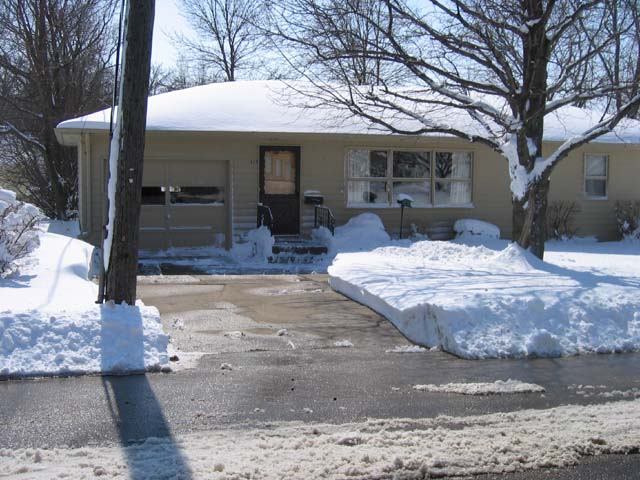 Snow-free driveway across the street