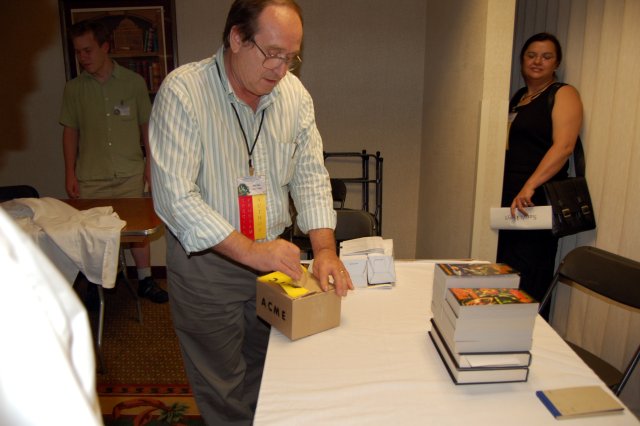 Sarah hiding behind a wall