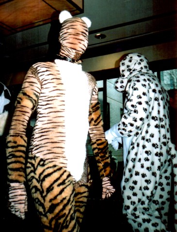 Masked tiger and spotty dog.